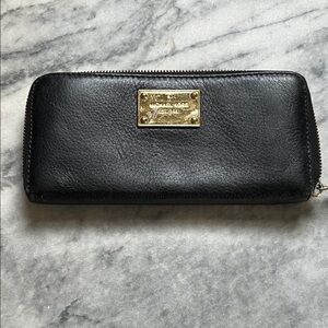Michael Kors Black Leather Zip Wallet with Gold Plate Logo. In good used . Check